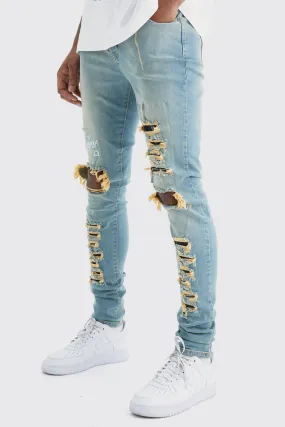 Tall Skinny Stretch Multi Rip Graphic Jeans | boohooMAN UK